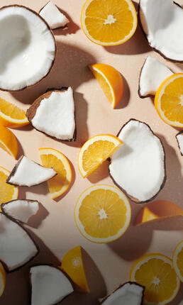 sliced coconuts and oranges