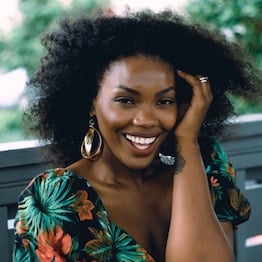Woman with healthy looking and naturally curly black hair