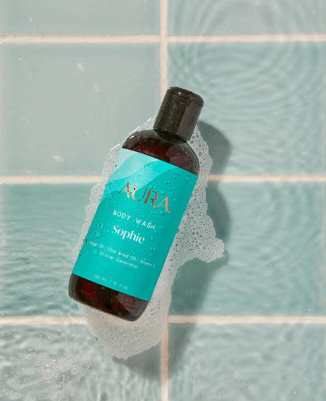 AURA Body Wash floating in a clean tub of water