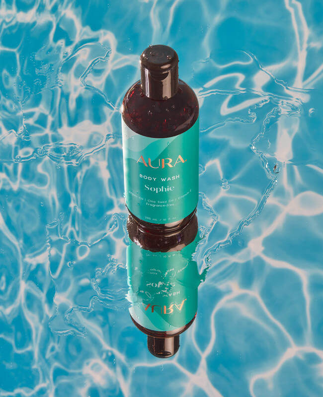 AURA Body Wash floating on water