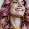Woman with curly hair and purple hair color thumbnail
